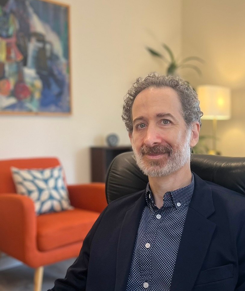 Jonathan Schnapp, LCSW, seated in his psychotherapy office